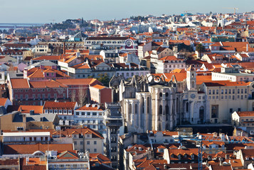 Fototapeta na wymiar Lisbon. Top view on the historic city center, the ruins of the monastery of Carmo and the carved metal lift of Santa Justa from the observation deck from the fortress Saint George