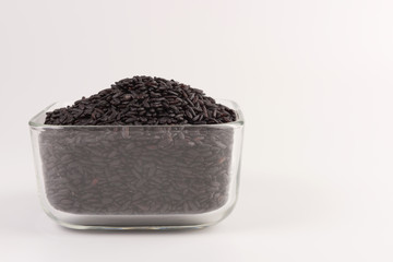 bowl of black wild rice isolated on white background