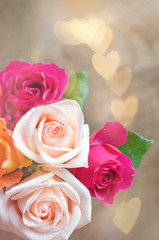 Pink and purple roses with hearts background. Valentine's day concept.