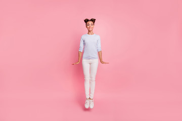 Full length body size view portrait of her she nice cute lovely attractive winsome pretty cheerful cheery girl jumping up straight isolated over pink pastel background
