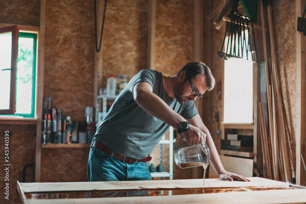 Wall mural artisan carpenter working in his workshop