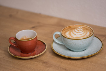 Close up coffee cup with heart latte art on table