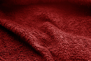 Fototapeta na wymiar Sack cloth texture with blur effect in red color.
