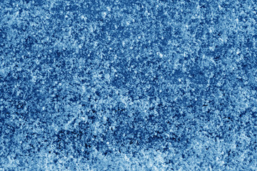 Fototapeta na wymiar Frost on car glass texture in navy blue tone.