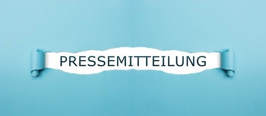 Pressemitteilung auf gerissenen Papier