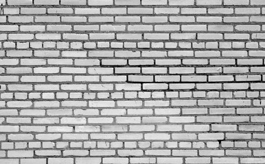 Old brick wall surface in black and white.