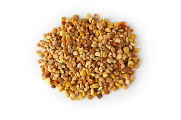 Pile of bee pollen grains isolated on white background