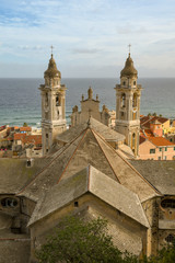 Elevated view of the back of the church of St Matthew with the Ligurian Sea in the background, Laigueglia, Liguria, Italy