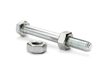 Nuts and bolt on white background. Selective focus.