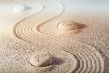 Fototapeta na wymiar Zen stones in the sand