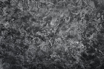 Flour on a black stone background. Top view. Free copy space.