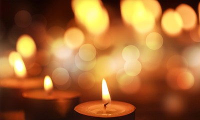 Close up view of the candles cutting through the darkness.