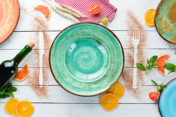 A plate on a wooden table. Table service concept. On a wooden background. Top view. Free copy space.
