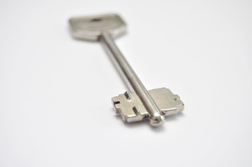 Door key on white backgroundDoor key on white background