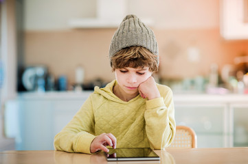 Little boy using digital tablet.