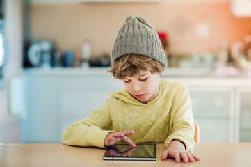 Little boy using digital tablet.
