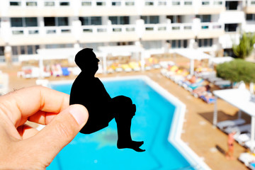 silhouette of a man throwing himself into a pool