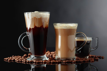 Various coffee drinks on a black background.