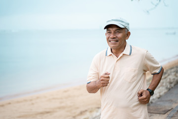 mature asian man doing sport outdoor