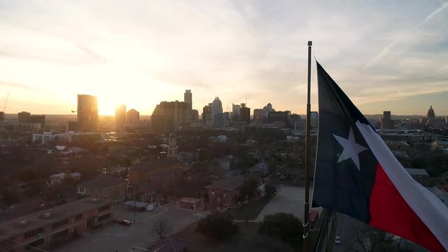 4K Texas Flag Aerial at Sunset with Austin in Back