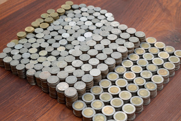 Lots stack coins on wooden desk background texture, Money for business planning investment and saving concept
