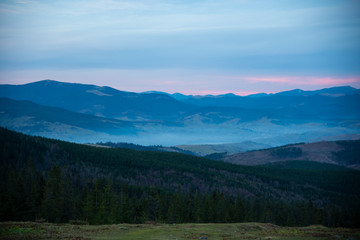 Fototapeta na wymiar Beautiful dramatic sunset in the mountains autumn