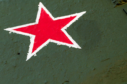 Red star on green steel plate