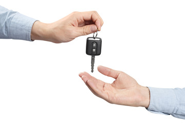 Two hands, giving and taking a car key, isolated on white background