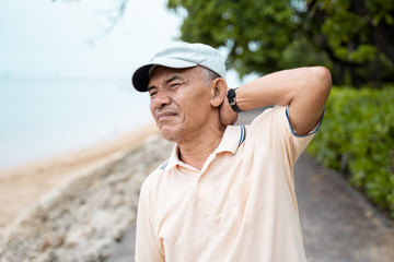 Obraz premium senior male having neck pain