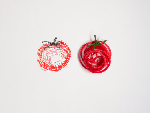 Two conceptual tomatoes
