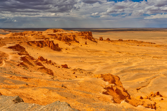 View of Flaming Cliffs against cloudy sky