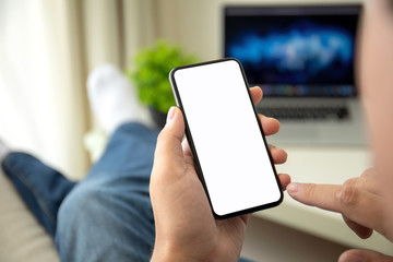 male hands holding phone with isolated screen in a room