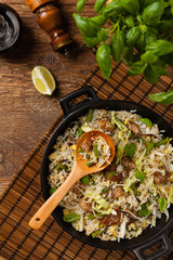 Fried veal, with rice, Chinese cabbage and mushrooms. Sprinkled with sesame and soy sauce.