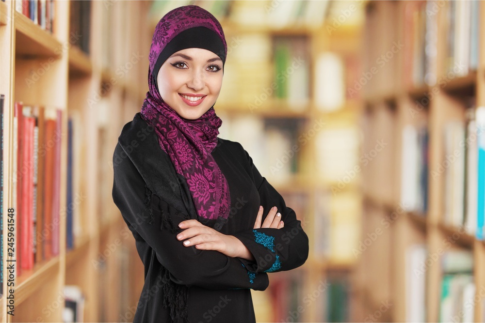 Wall mural Close-up Beautiful Young Muslim Woman on blurred background