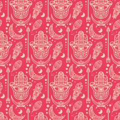 Boho style seamless hamsa palm pattern. Pink bohemian seamless background. Ethnic indian ornament texture print with arrows, feathers and moons