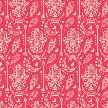 Boho style seamless hamsa palm pattern. Pink bohemian seamless background. Ethnic indian ornament texture print with arrows, feathers and moons