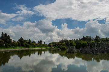 Fototapeta na wymiar Stone Forest or Shilin with lake in Yunnan China