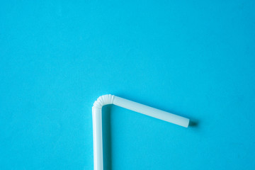 White Straw on blue background. Minimal and reduce use plastic concept.-Image.