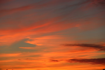 Orange sunset before night. Twilight with bright sunset. Evening landscape