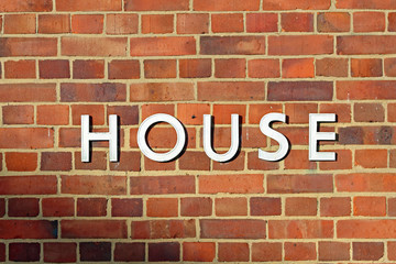 Fototapeta na wymiar House Letters Brick Wall