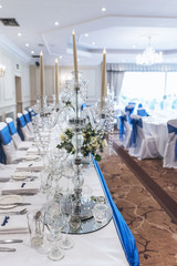 wedding dining reception area with decorative tables and chairs