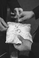 Wedding rings on vintage pillow before the ceremony