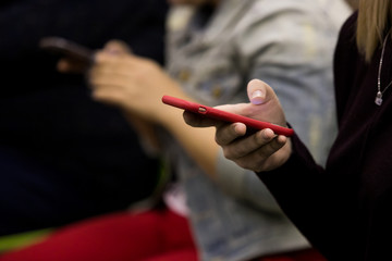 business people hands typing on smart phone during the seminar at conference room