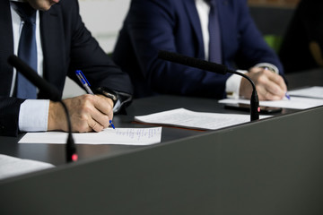 Business people writing notes