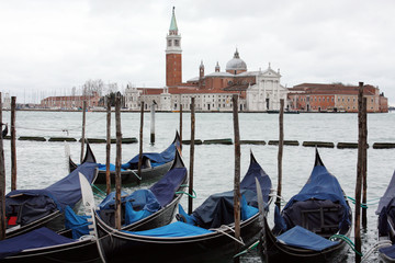 Gondolas in Venice Italy Adriatic sea. Markusdom. St Mark's Basilica Square. Saint Marco Square.	