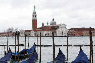 Gondolas in Venice Italy Adriatic sea. Markusdom. St Mark's Basilica Square. Saint Marco Square.	