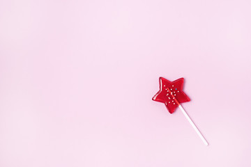 Stars Shaped Lollipop on Light Pink Background Homemade Fruit Lollipop Candy Background Flat Lay...