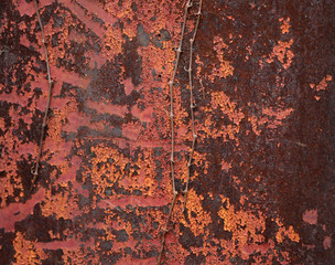 peeling old red lead paint on side of old gas pump