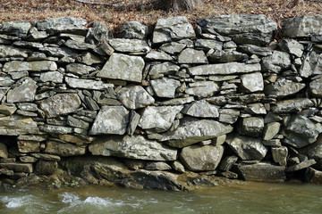 angular rock retaining wall along the historic Potomac Canal, Virginia, USA