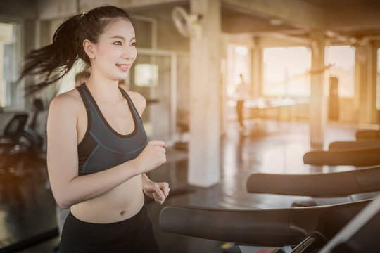 Side view of attractive sports women on running track. Healthy, sports, lifestyle, Fitness concept.